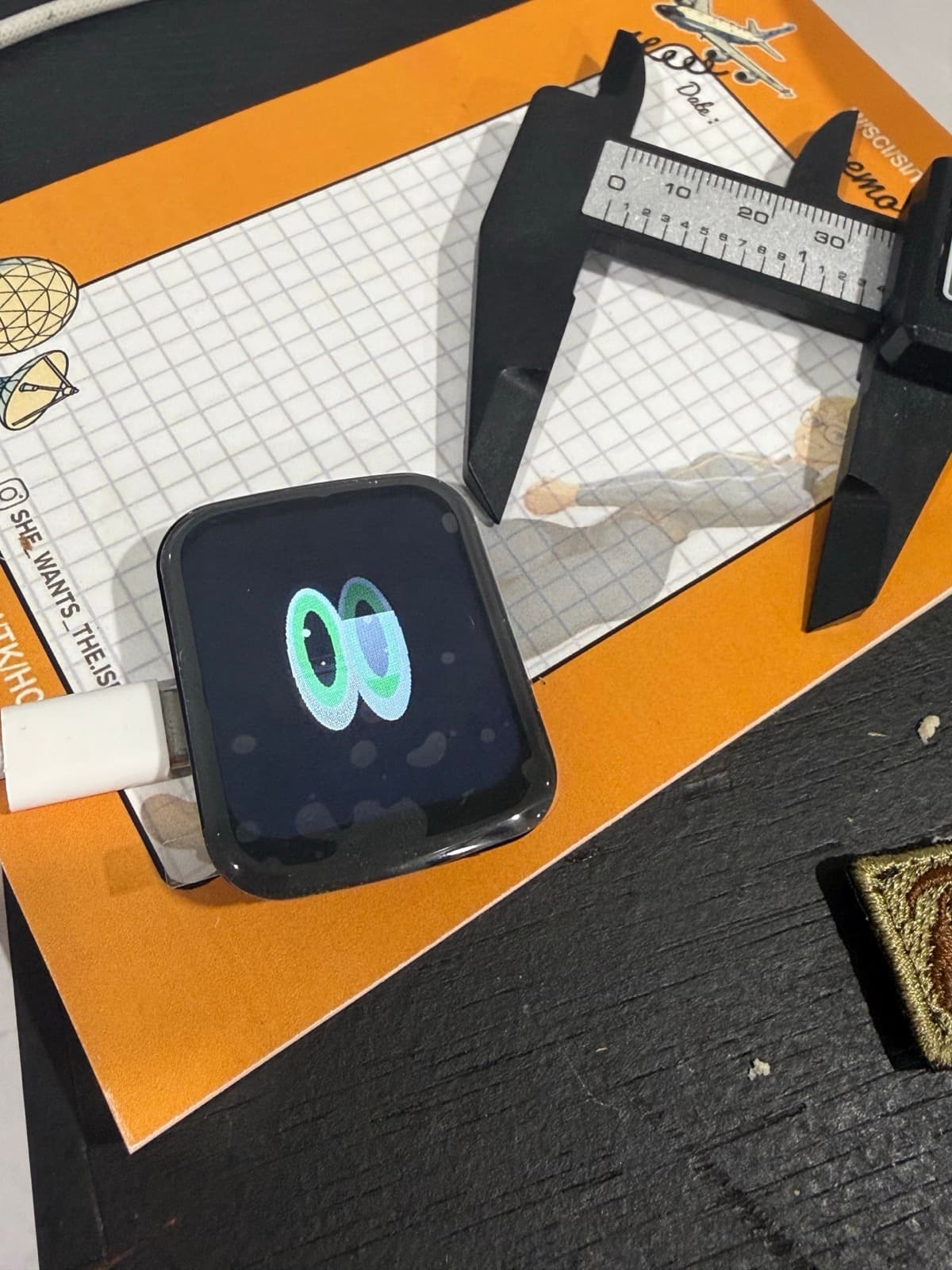 The actual USB-powered MaxBot bench unit rendering a turquoise and violet eye expression.
